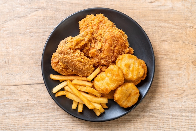 fried chicken with french fries and nuggets meal