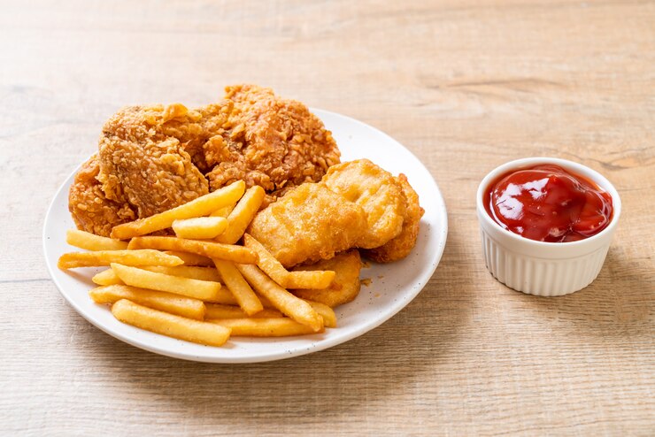 fried chicken with french fries and nuggets meal