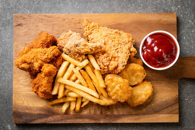 fried chicken with french fries and nuggets meal