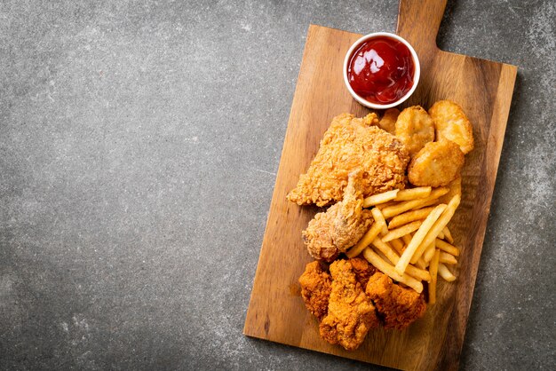 fried chicken with french fries and nuggets meal