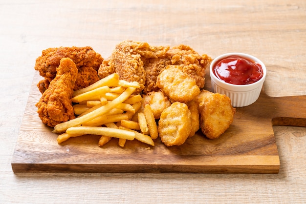 fried chicken with french fries and nuggets meal