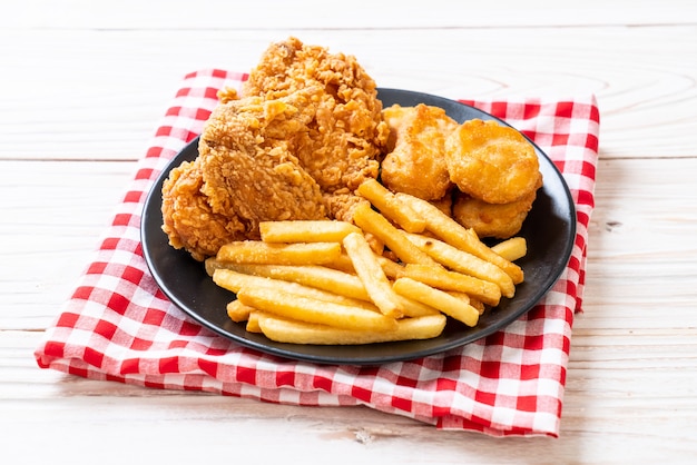 fried chicken with french fries and nuggets meal