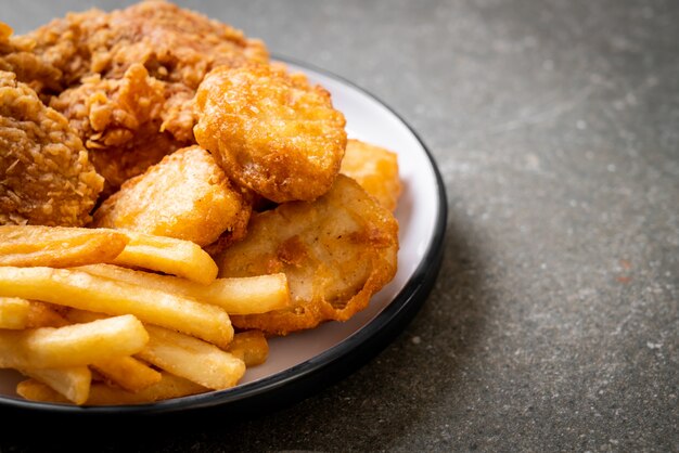 fried chicken with french fries and nuggets meal