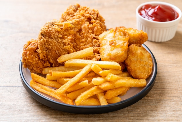 fried chicken with french fries and nuggets meal