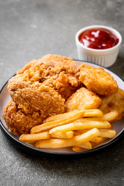 fried chicken with french fries and nuggets meal