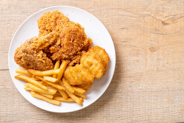 fried chicken with french fries and nuggets meal