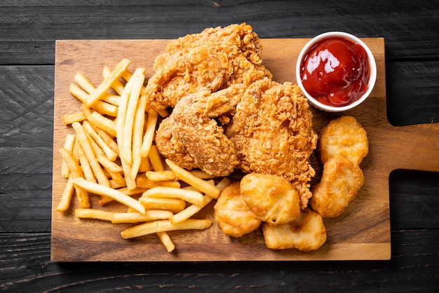 fried chicken with french fries and nuggets meal