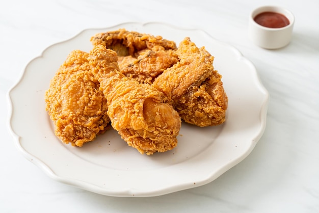 Fried chicken with ketchup on plate unhealthy food