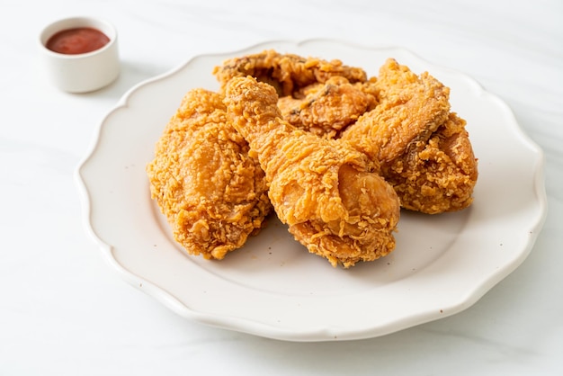 Fried chicken with ketchup on plate