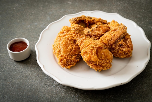 Fried chicken with ketchup on plate