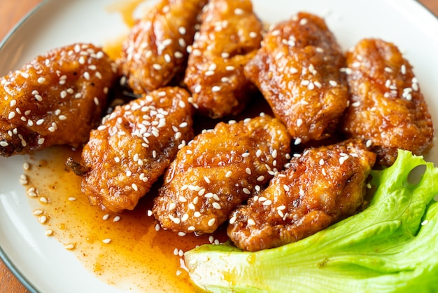 fried chicken with Korean spicy sauce and white sesame