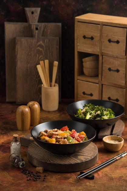 Fried Chicken with red yellow and green pepper on wood cutting board