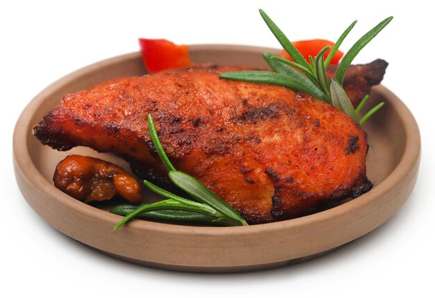 Fried chicken with rosemary over white background