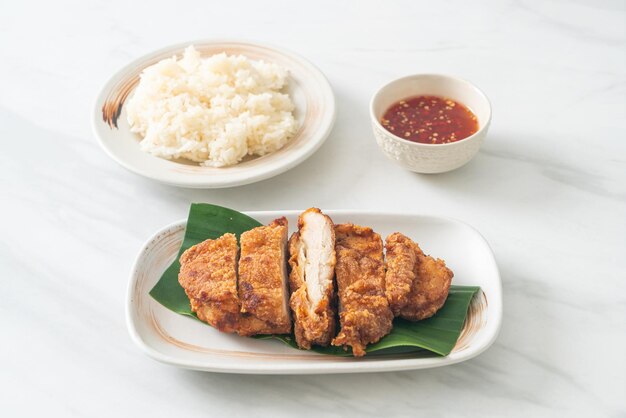 fried chicken with sticky rice and spicy sweet sauce