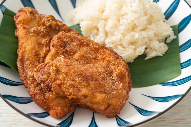 fried chicken with sticky rice and spicy sweet sauce