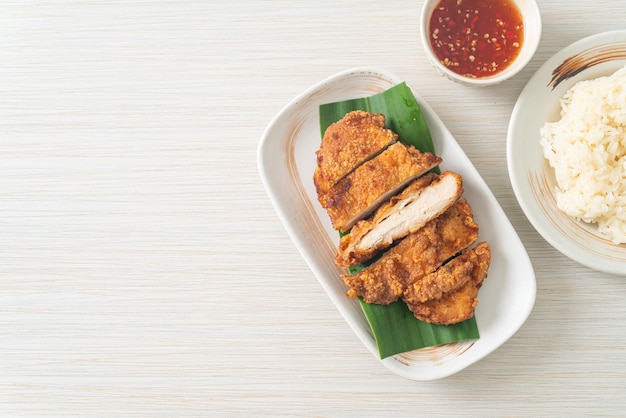 fried chicken with sticky rice and spicy sweet sauce