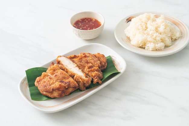 fried chicken with sticky rice and spicy sweet sauce