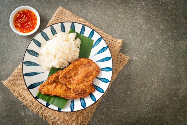 fried chicken with sticky rice and spicy sweet sauce