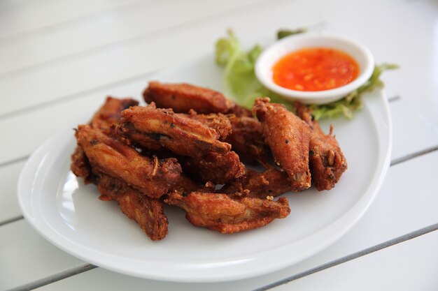 Fried chicken on wood background