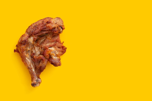 Fried chicken on yellow background.