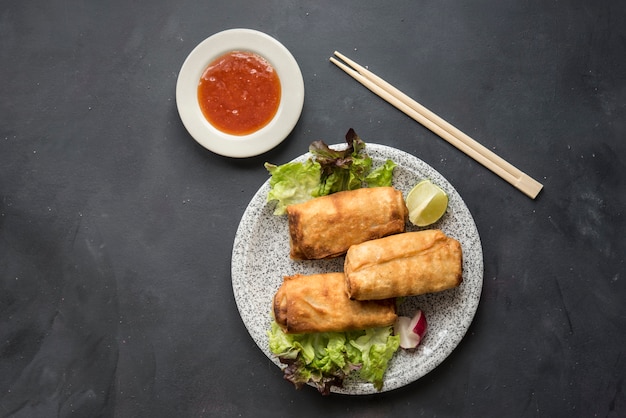 Fried chinese spring rolls with sweet chili sauce