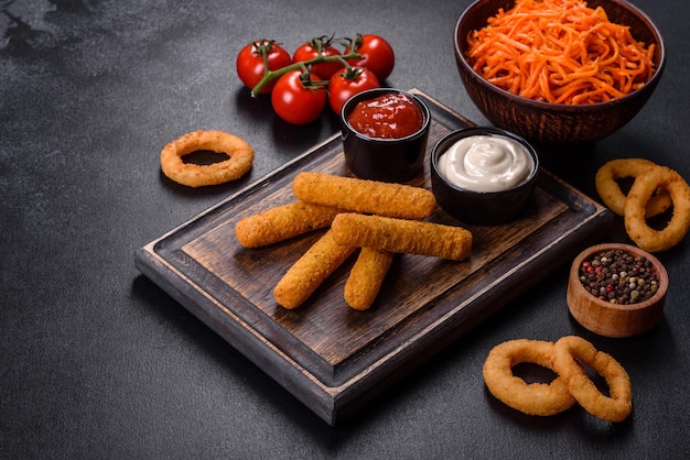 Fried crispy nutritious cheese or potato sticks Snacks for beer