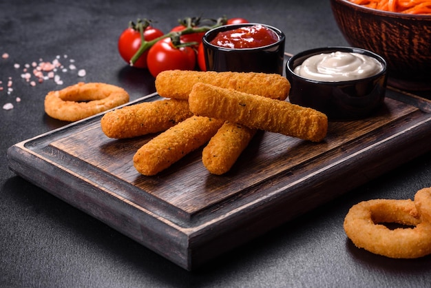 Fried crispy nutritious cheese or potato sticks Snacks for beer