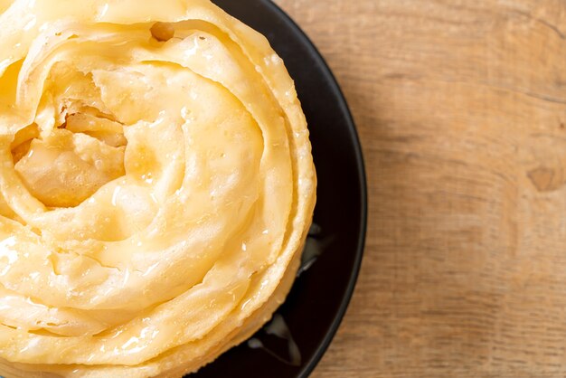 fried crispy roti dough with sweetened condensed milk