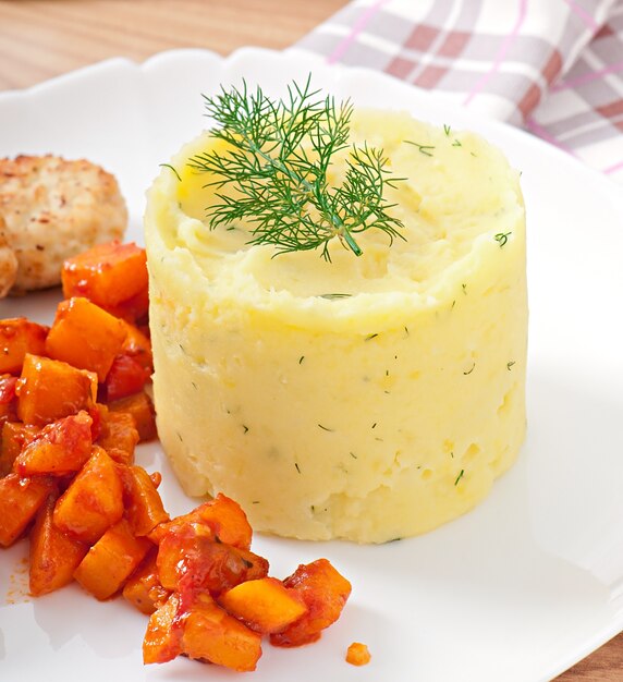 Fried cutlets, stewed pumpkin and mashed potatoes