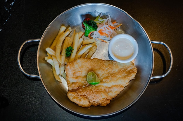 Fried dory with added french fries and some vegetables