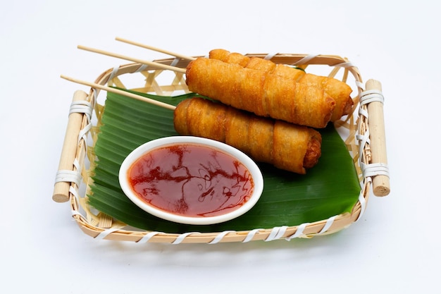 Fried dough snacks wrapped sausage on white background.