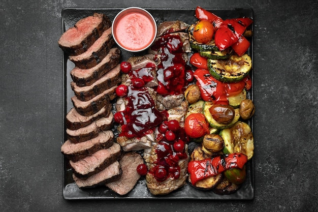 Fried duck breast with cherry sauce and grilled vegetables with mushrooms