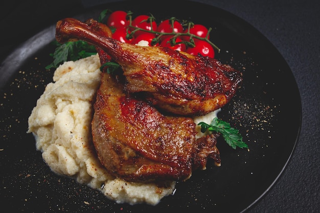 Fried duck shank cauliflower puree cherry tomatoes homemade no people