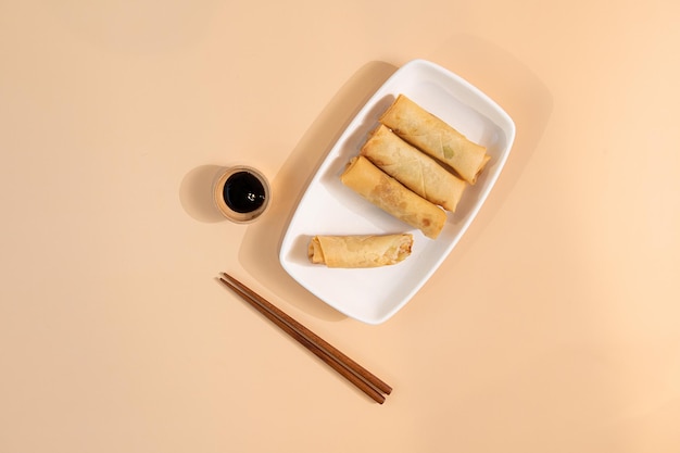 a fried dumplings sauce and chopsticks on the plate