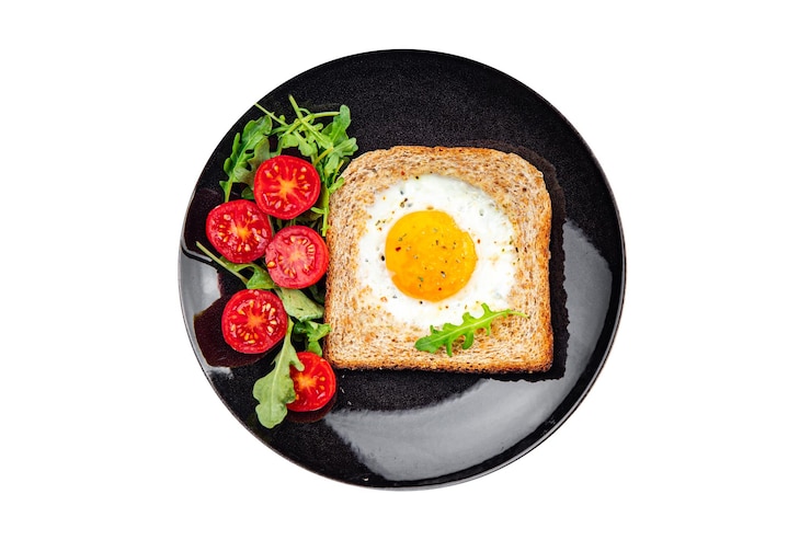 Фотография жареный хлеб с яйцами тост смешанный желток белок вкусный завтрак сытная еда свежая