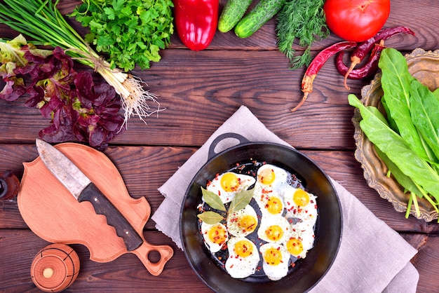 Fried egg and fresh vegetables and herbs