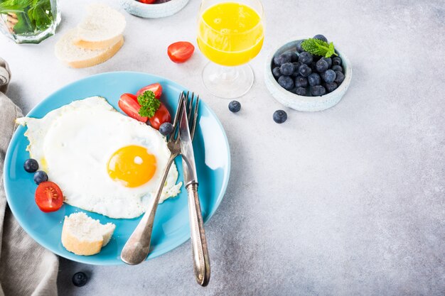 Fried egg and orange juice