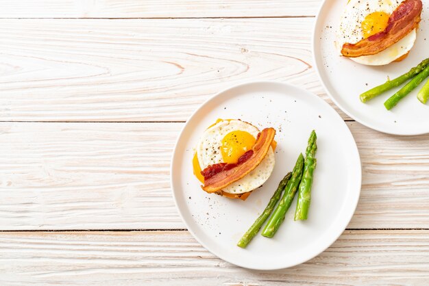 fried egg with bacon and cheese on pancake