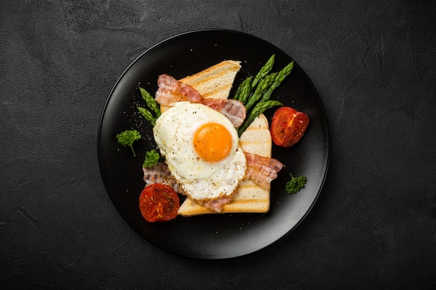Fried egg with bread toast and asparagus