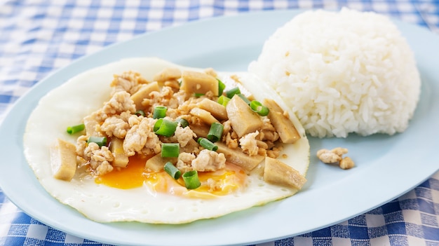 Fried egg with cooked rice.