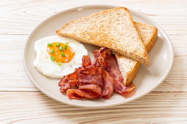 fried egg with toasted bread and bacon