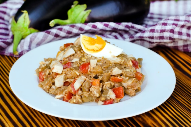 Fried eggplant salad with tomato and egg