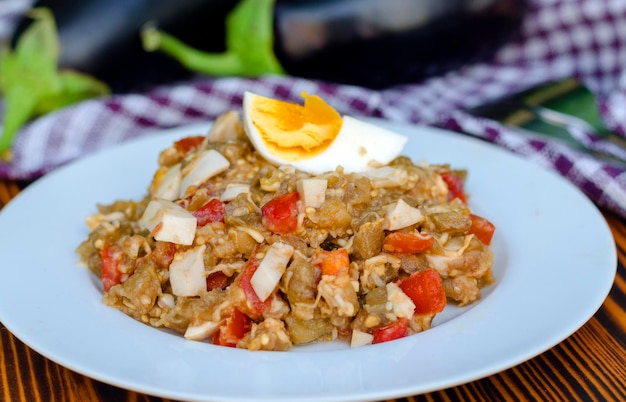 Fried eggplant salad with tomato and egg