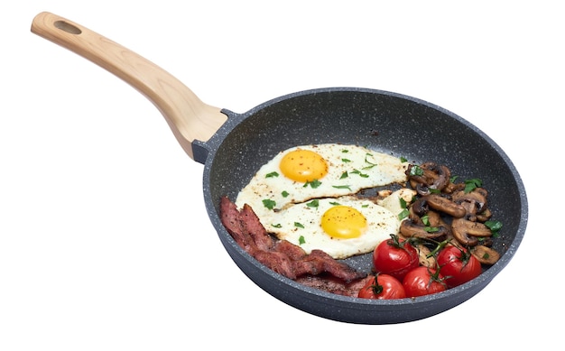 Fried eggs and bacon on a frying pan isolated on white background