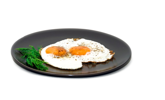 Fried eggs on the plate