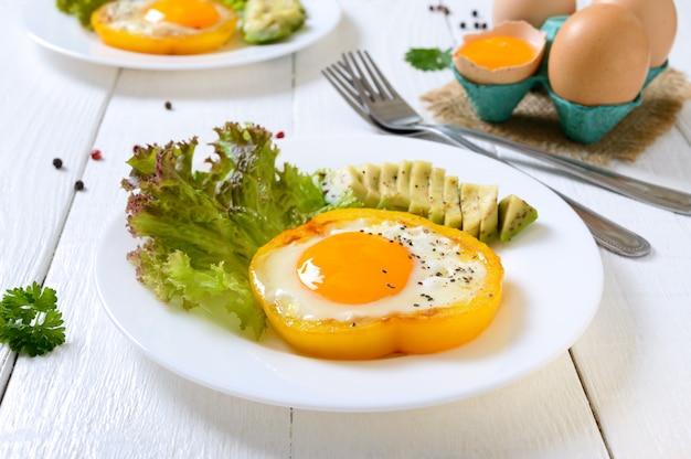 Fried eggs in a ring of yellow bell pepper