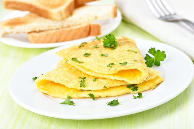 Fried eggs with herbs on white plate