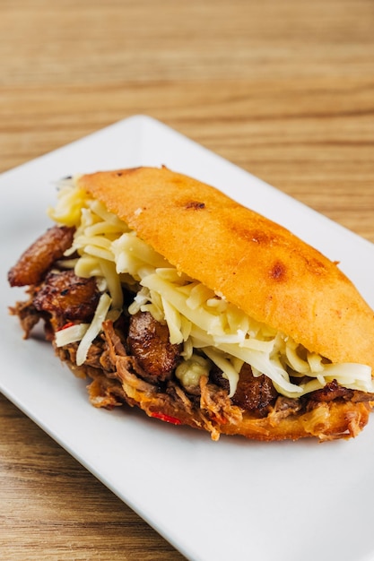 Photo fried empanada made with yellow cheese chicken and fried plantain venezuelan food