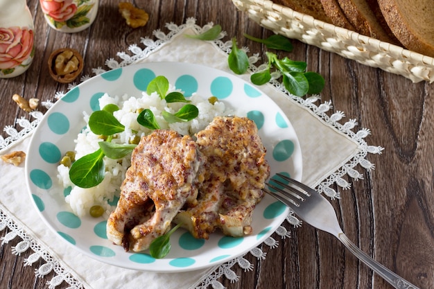 Fried fish in batter nut on a wooden table