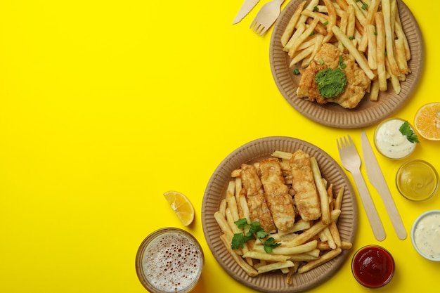 fried fish and chips isolated on yellow